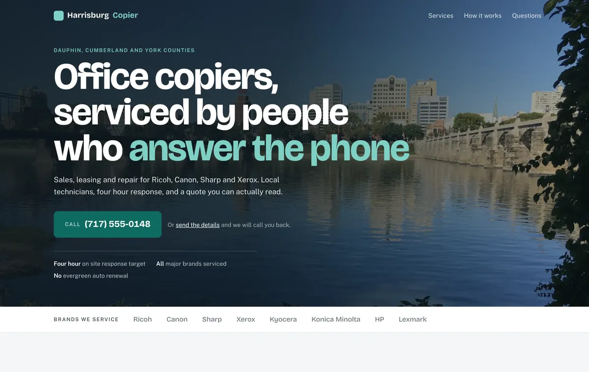 The rebuilt front page, showing a full bleed photograph of Harrisburg across the Susquehanna with one large call button carrying the phone number